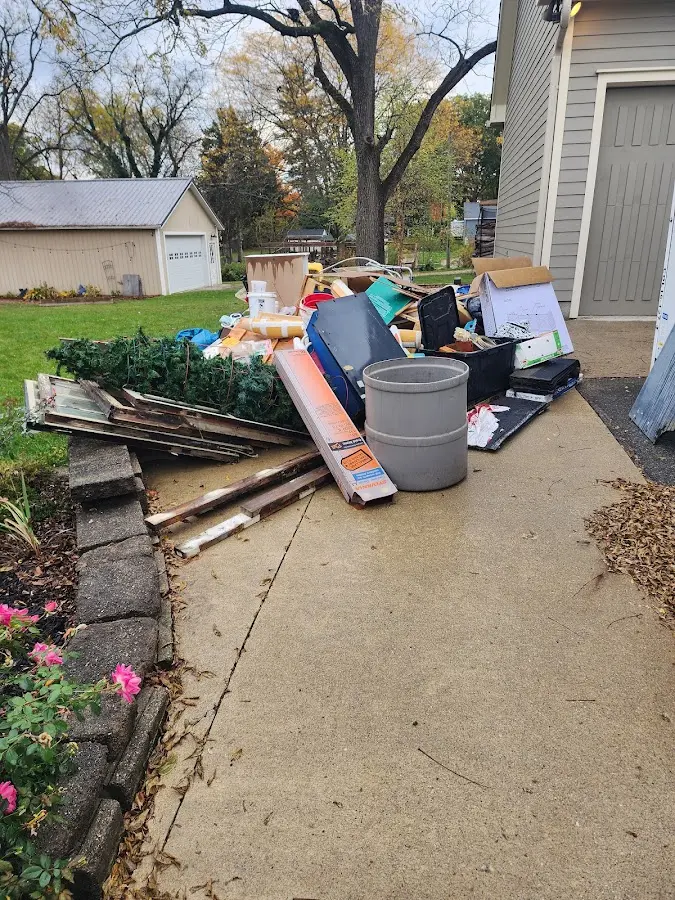 Dumpster being loaded with debris for 3 Yard Dumpster Rental in Missoula